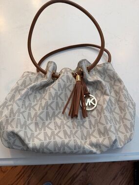 Michael Kors Beige Logo Drawstring Shoulder Bag with Brown Tassel